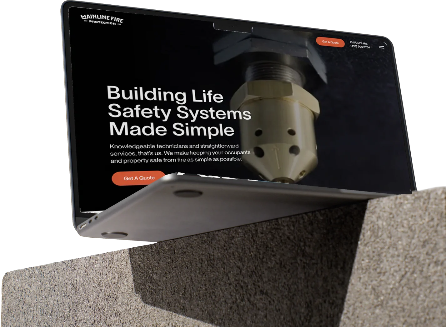 Mainline Fire Protection website shown on a laptop